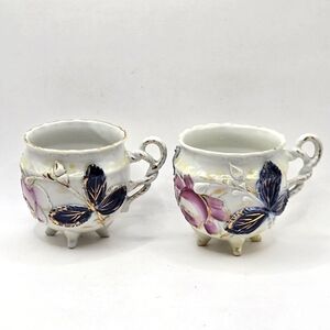 Pair Antq Lusterware Teacup German Porcelain High Relief Floral Design 4-Footed